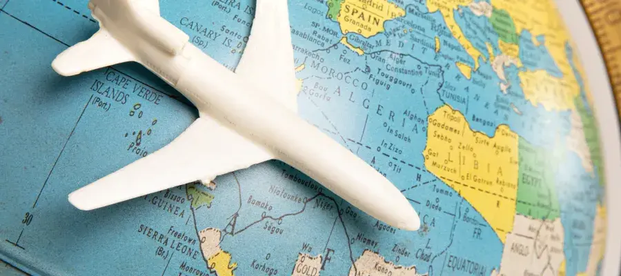 Blue globe with mini toy plane on top