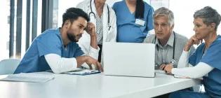 Group of researchers and nurses sitting around the table