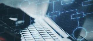 Abstract image of person typing on laptop