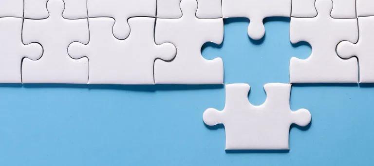 Blue background, white jigzaw puzzles