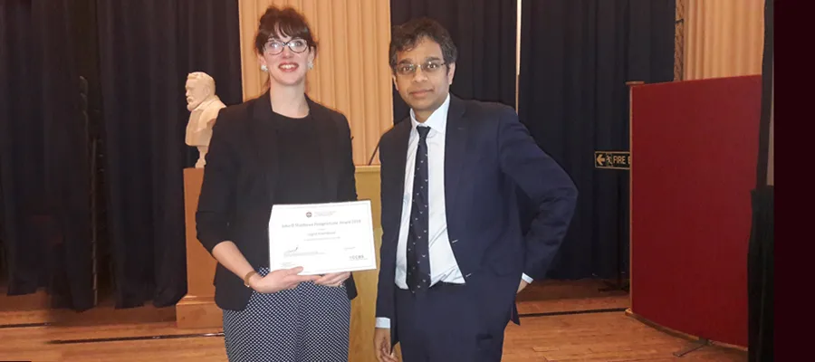 Dr Ingrid Hoeritzauer is presented with the John D Matthews Award by Professor Siddharthan Chandran