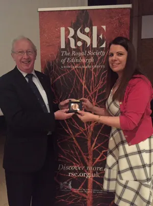Professor Stuart Monro FRSE awarding Sinead her medal