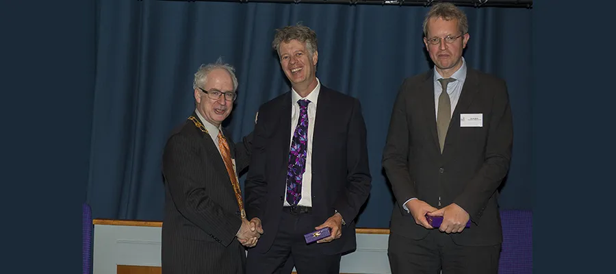 Alan Carson (centre) and Jon Stone (right) receive the President's Medal