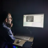 Dr Ian Maccormick viewing images from the new camera