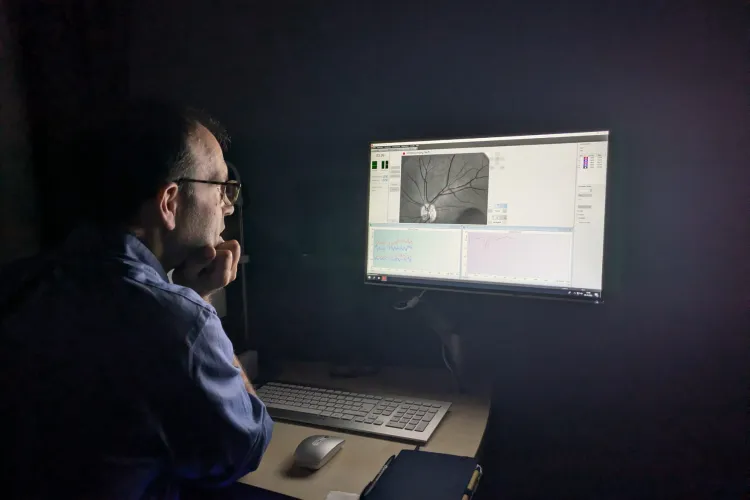 Dr Ian Maccormick viewing images from the new camera