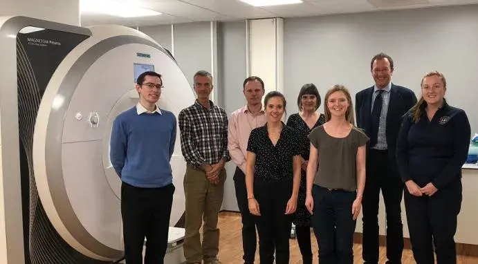 MSS3 team standing in front of scanner