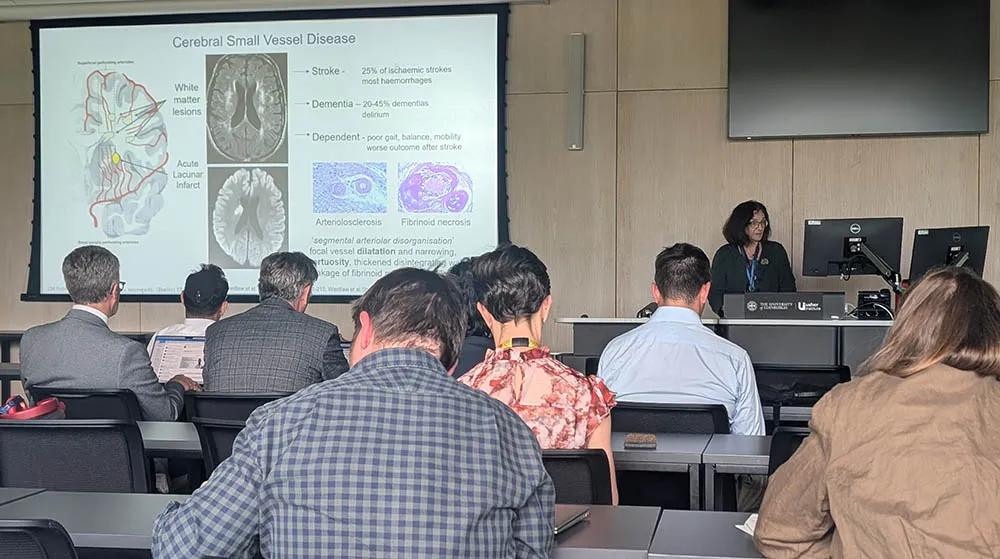 Professor Joanna Wardlaw presenting in front of audience