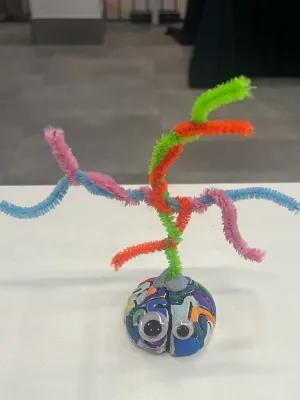 Example decorated brain with pipe cleaners for hair